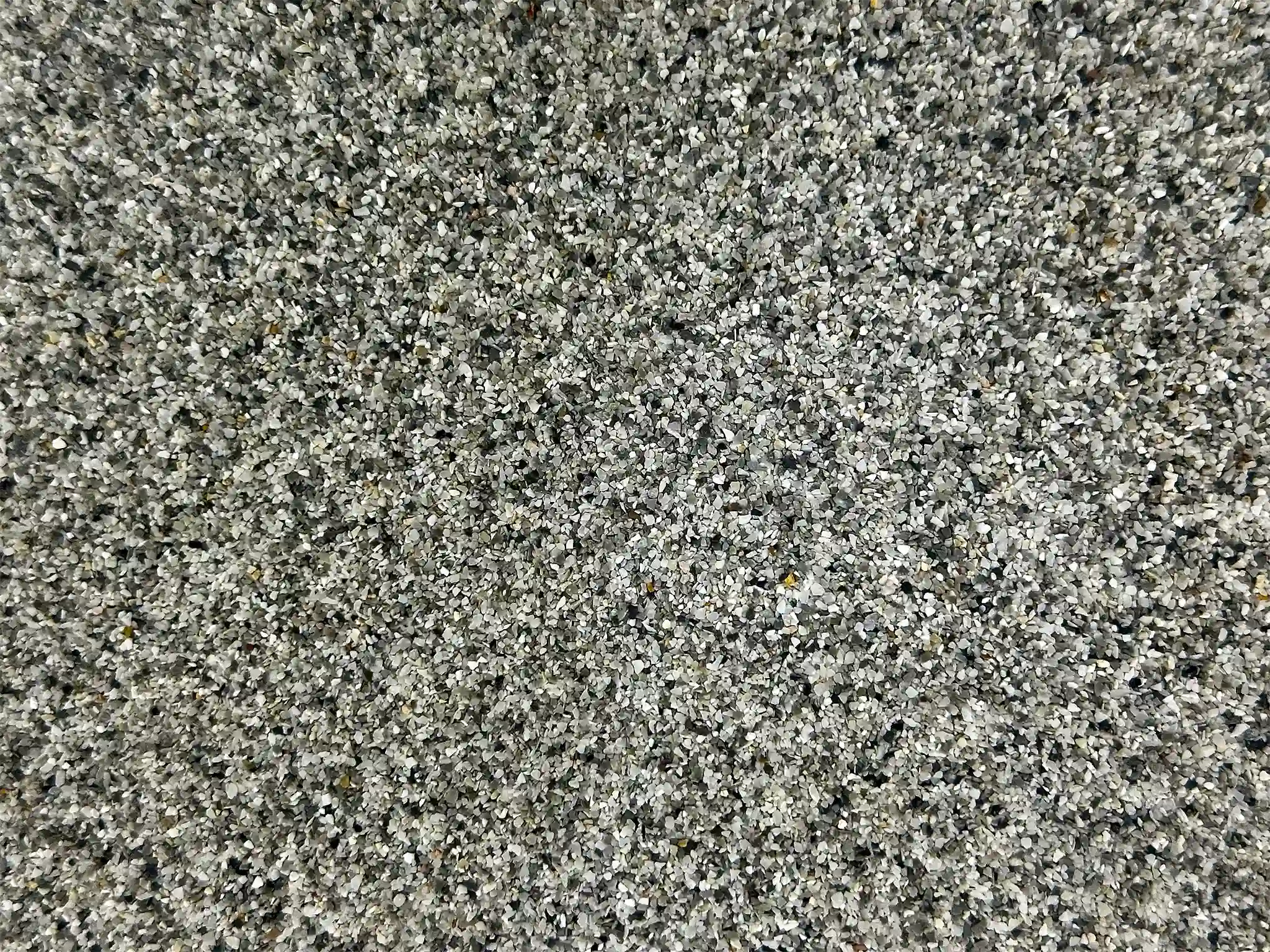 A close-up view of Slate Quartz Pool Pebble.